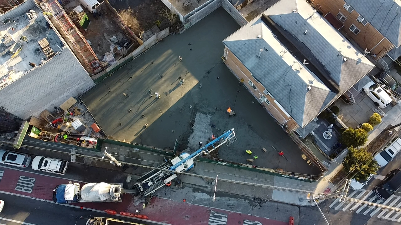Aerial of fresh concrete slab pour